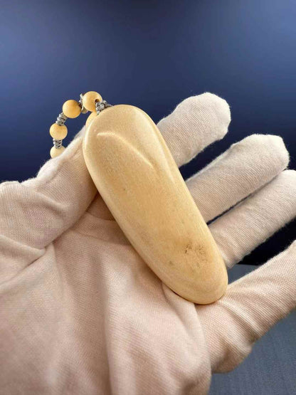 Wealth-Bringing Maitreya Tusk Handheld